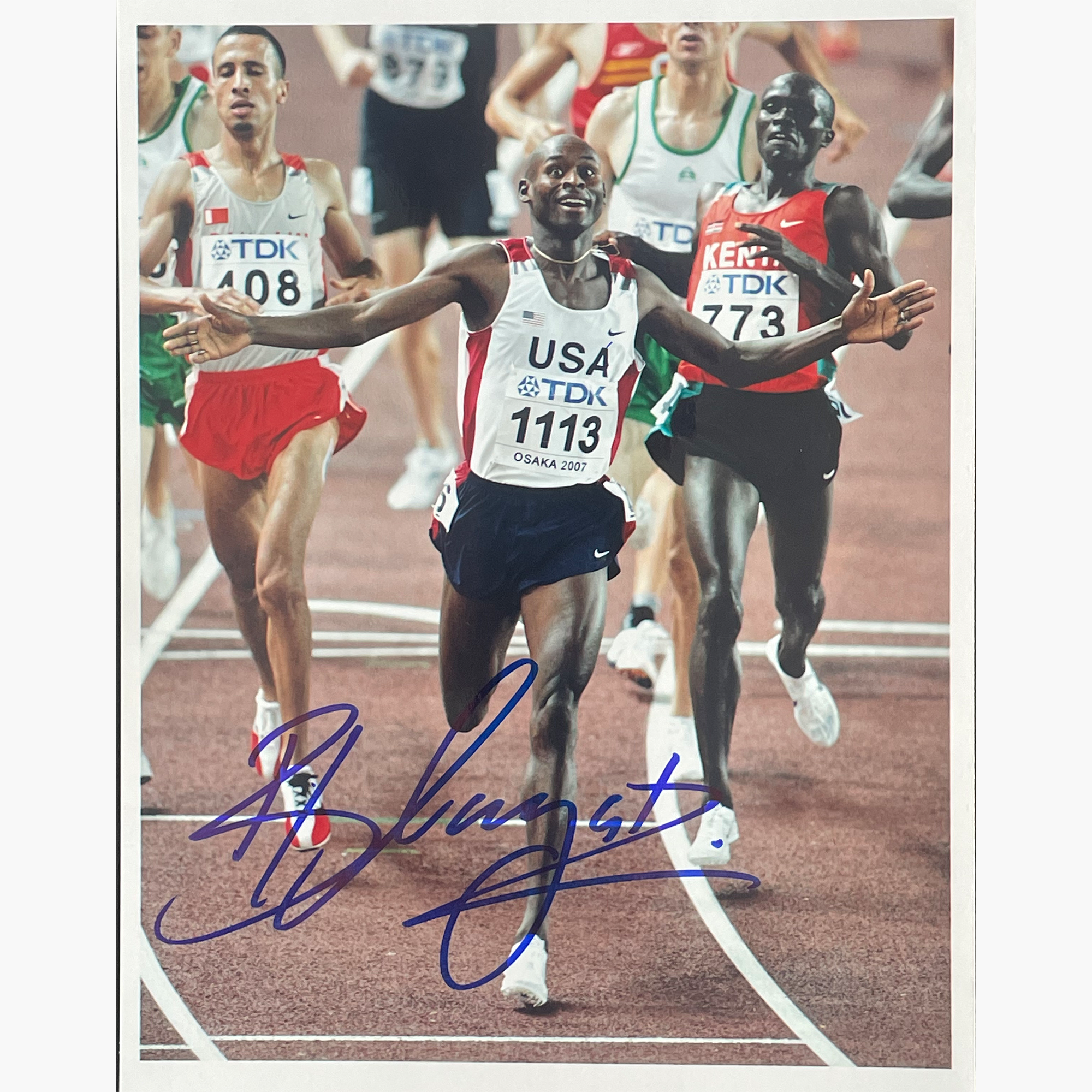 Bernard Lagat – Signed 19.5cm x 15cm Colour Action Photo