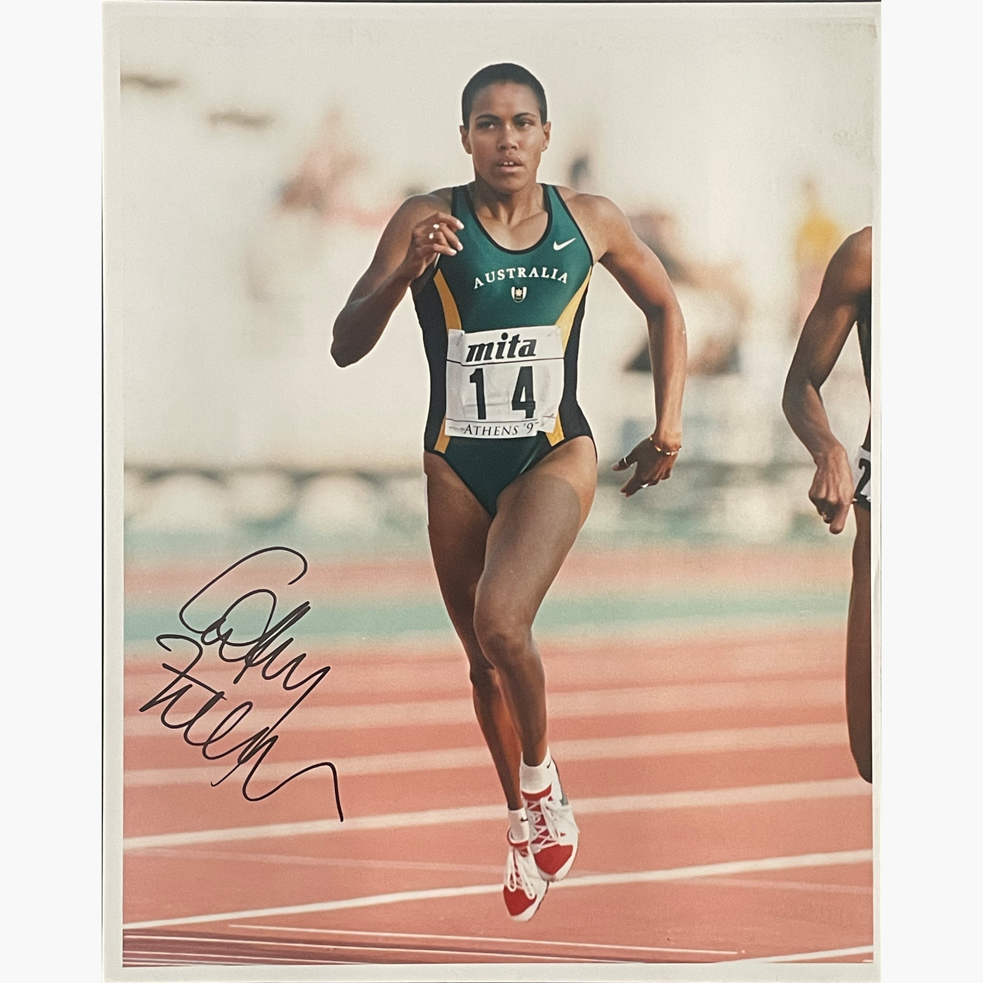 Cathy Freeman – Signed 25.5cm x 20.5cm Colour Action Press Photo