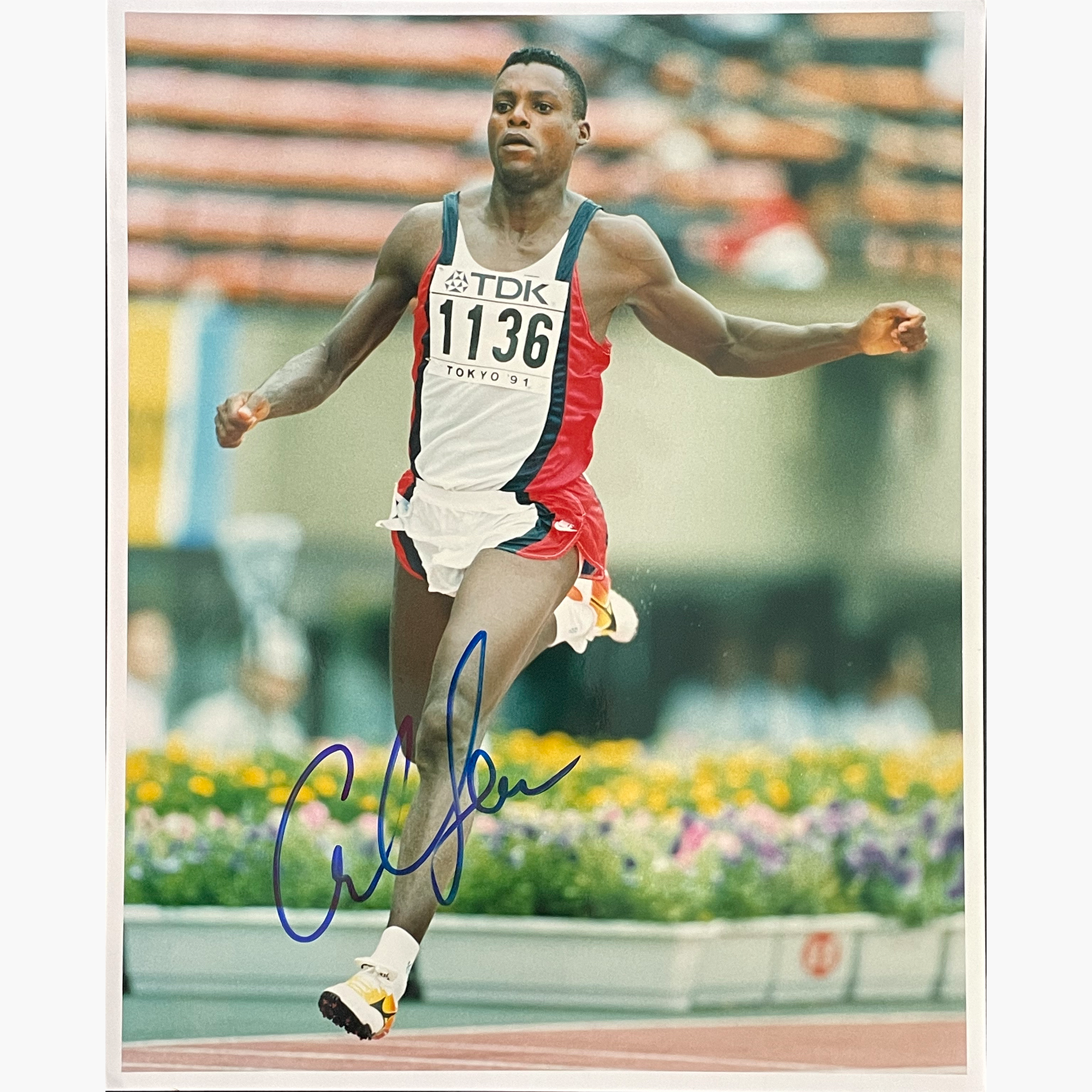 Carl Lewis – Signed 25.3cm x 20.2cm Colour Action Press Photo