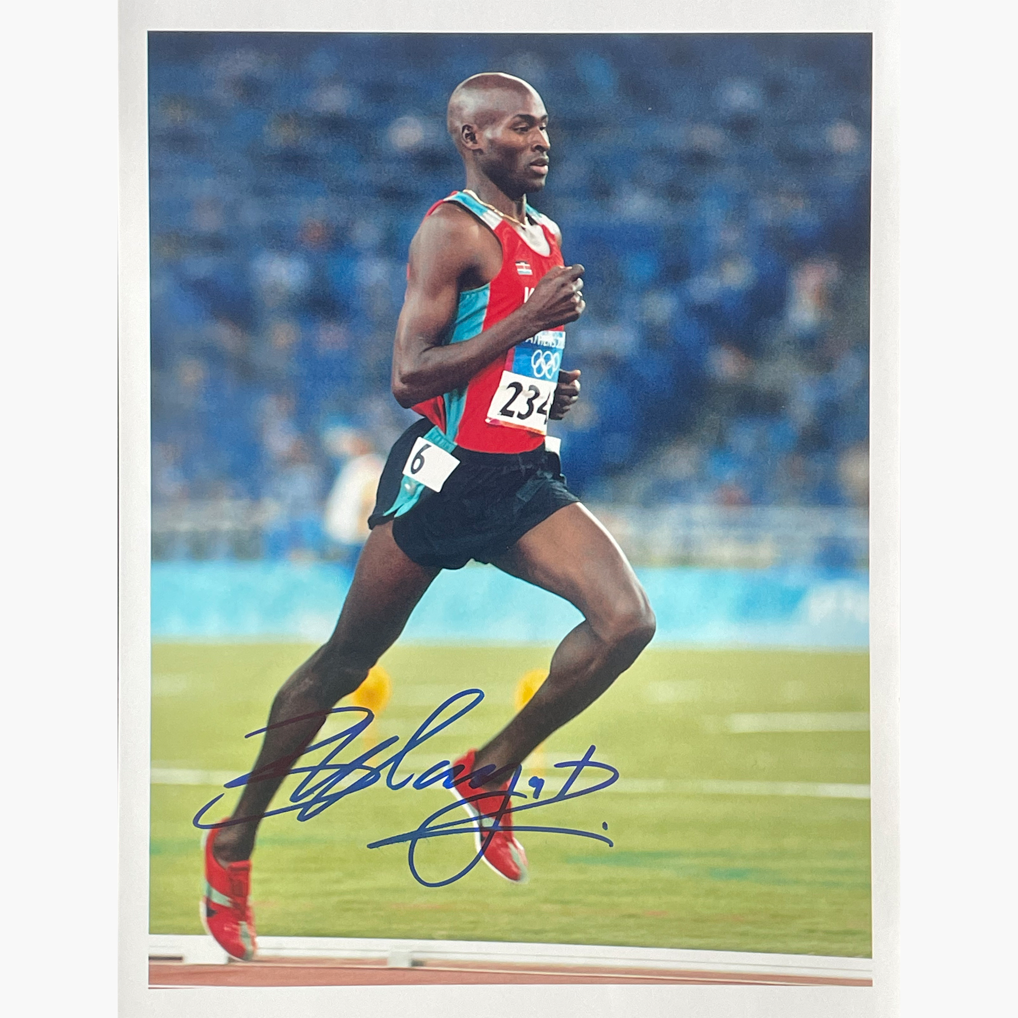 Bernard Lagat – Signed 25.5cm x 20.2cm Colour Action Photo