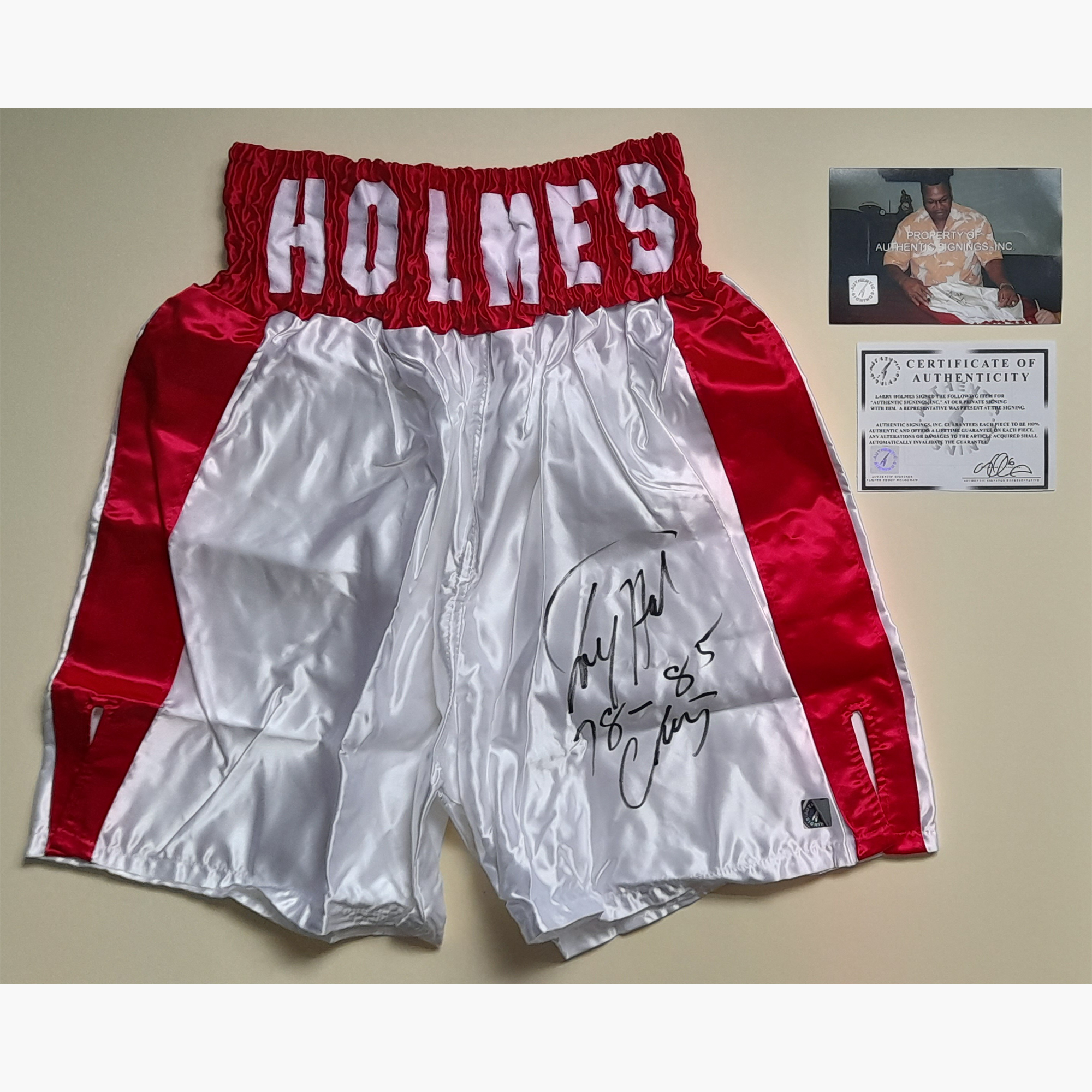 Larry Holmes Signed Boxing Trunks – Red & White with Inscription